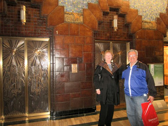 There are five elevators, their doors of solid brass intricately  designed.